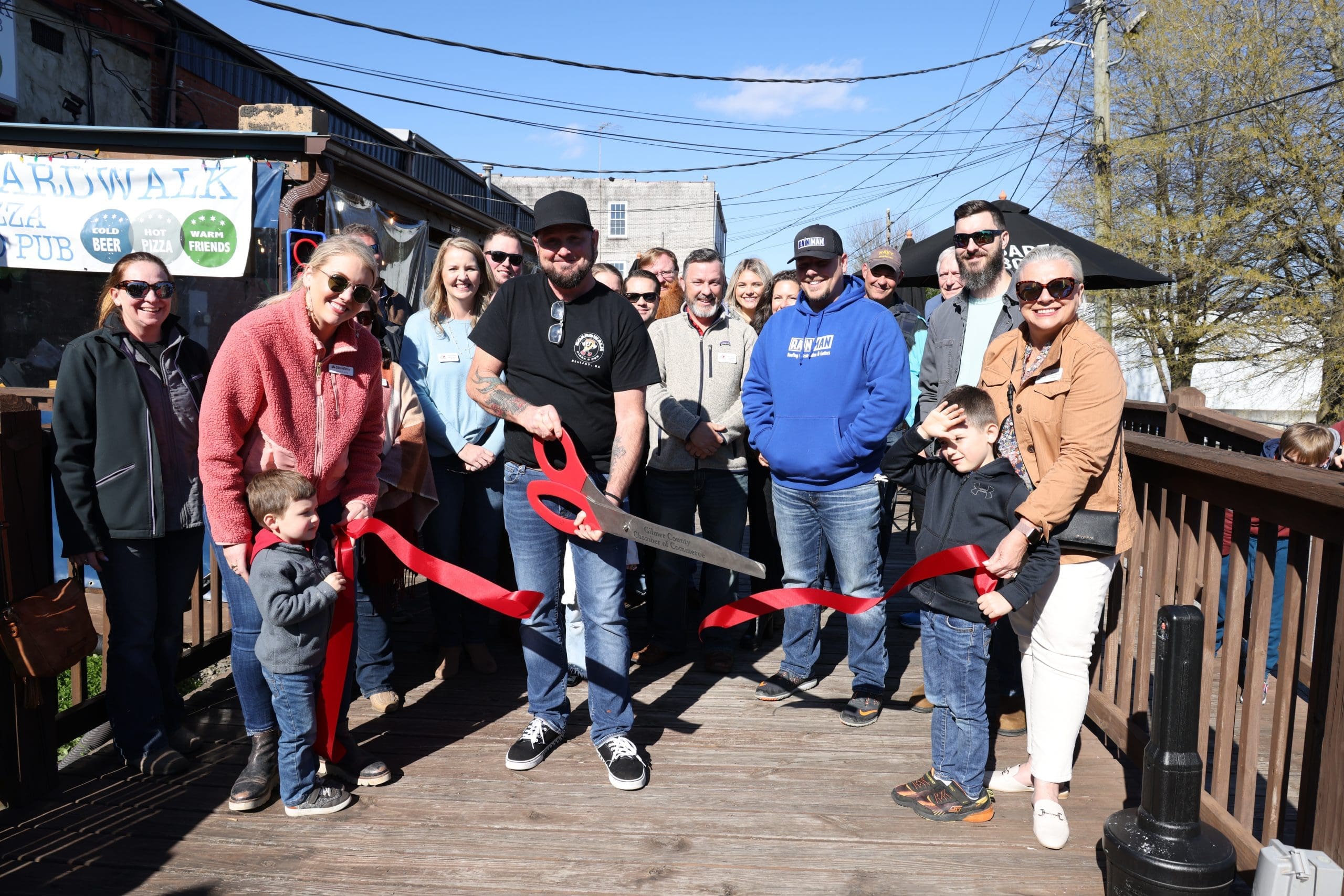 Boardwalk Pizza & Pub ribbon cutting with Owner Keith Burton, ambassadors and Gilmer BOD